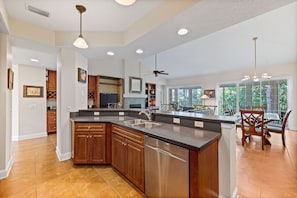 Enjoy cooking in this well-equipped kitchen with a large island, oven, and modern appliances.