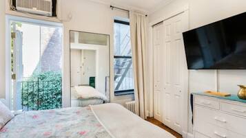 1 bedroom, desk, iron/ironing board, travel crib