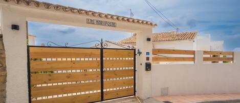 A gated entrance with a sign reading "Las Mariposas".