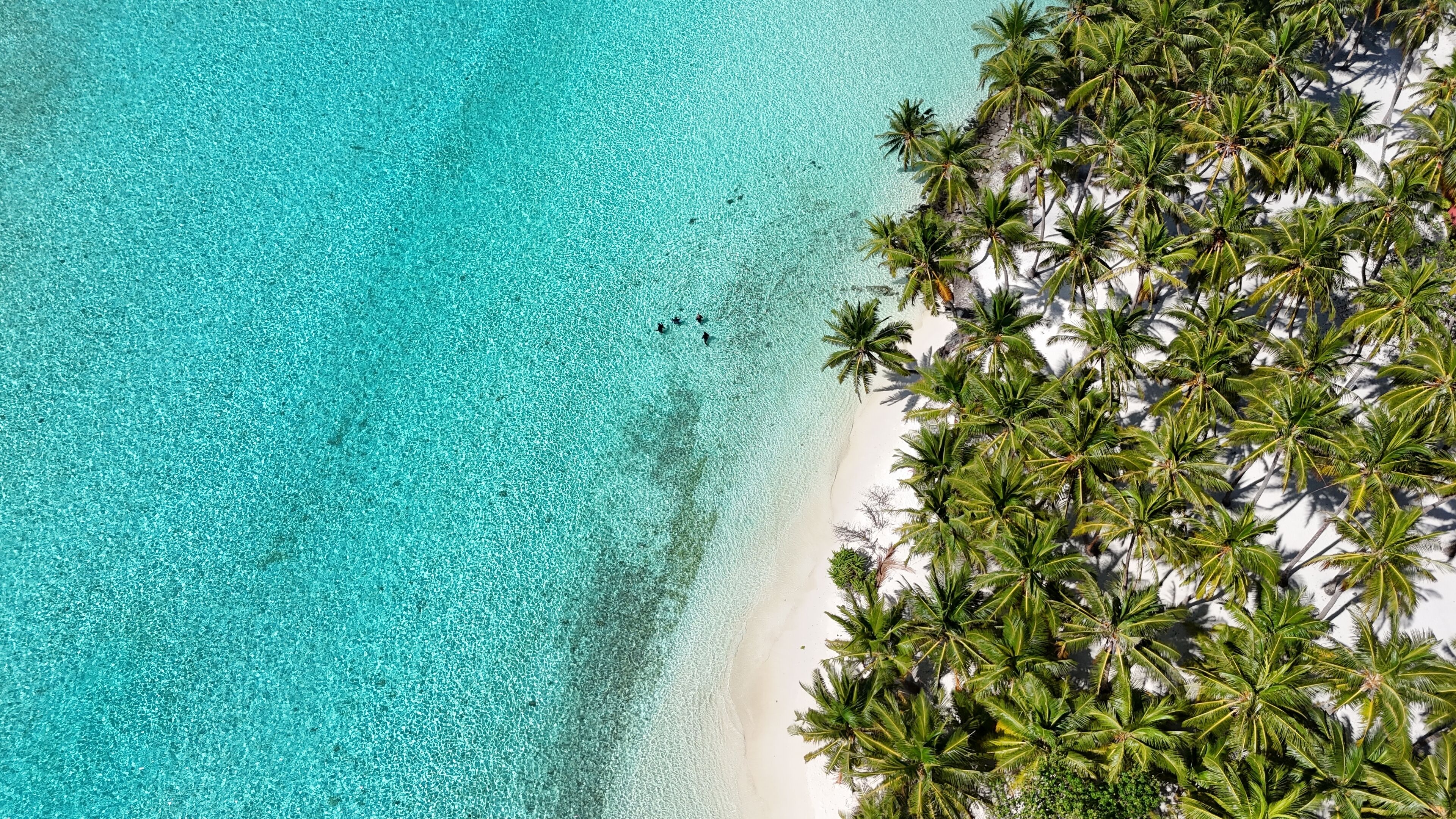 Beach nearby, white sand, beach umbrellas, beach towels