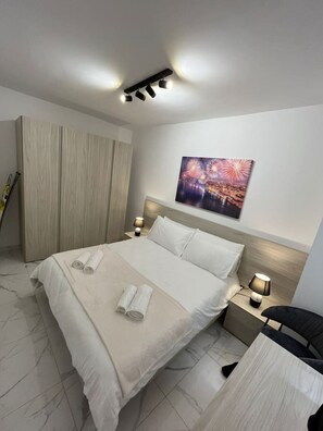 2 habitaciones, tabla de planchar con plancha, wifi y ropa de cama 