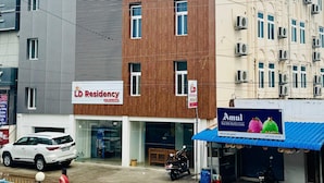 A multi-story building with a sign for 'LD Residency' indicating it is a residential property. - L D Residency (Kilvelur)