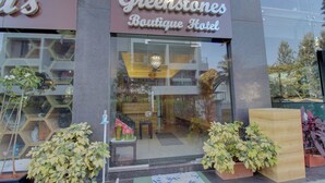 A boutique hotel entrance with a sign reading "Greenstones Boutique Hotel." - Greenstones Boutique Hotel (Nashik)