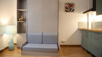 Deluxe Studio | Living area | Flat-screen TV