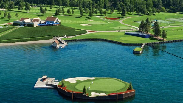 A golf course with a water body, a dock, and a clubhouse. - Guest Favorite, Peaceful, Walkable to Dinning & Shopping. 5-Star clean! (Coeur d'Alene)