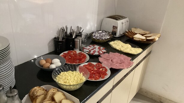 A kitchen counter with various food items and kitchen utensils. - guesthouse with pool with AC and WiFi in fabulous Naxxar/ Qawra (Naxxar)