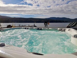 A hot tub with a view of a lake and mountains. - Quaint Lakefront Cottage w/Hot tub In Bellingham (Bellingham)