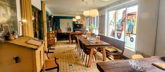 Vacation in a little school? Former classrooms with communal living kitchen!