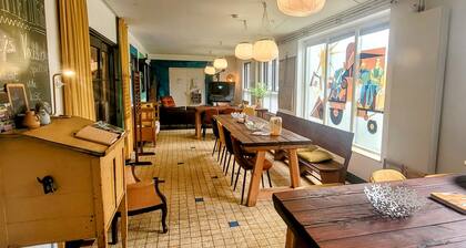 Vacation in a little school? Former classrooms with communal living kitchen!