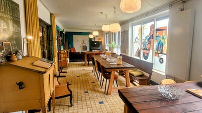 Vacation in a little school? Former classrooms with communal living kitchen!