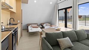 A compact living space with a kitchenette, a dining area, and a sofa. - Hurricane Oasis with Private Pool & Gorgeous Views (Hurricane)
