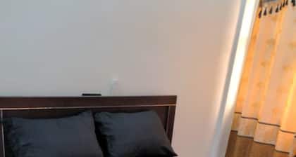 Charming 2-bedroom apartment with AC, WiFi along with security agent in Lome.