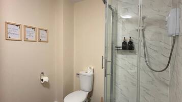 Shower, hair dryer, towels, soap