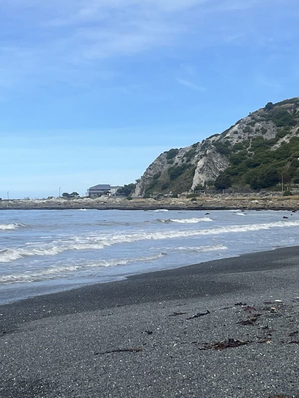 On the beach, black sand