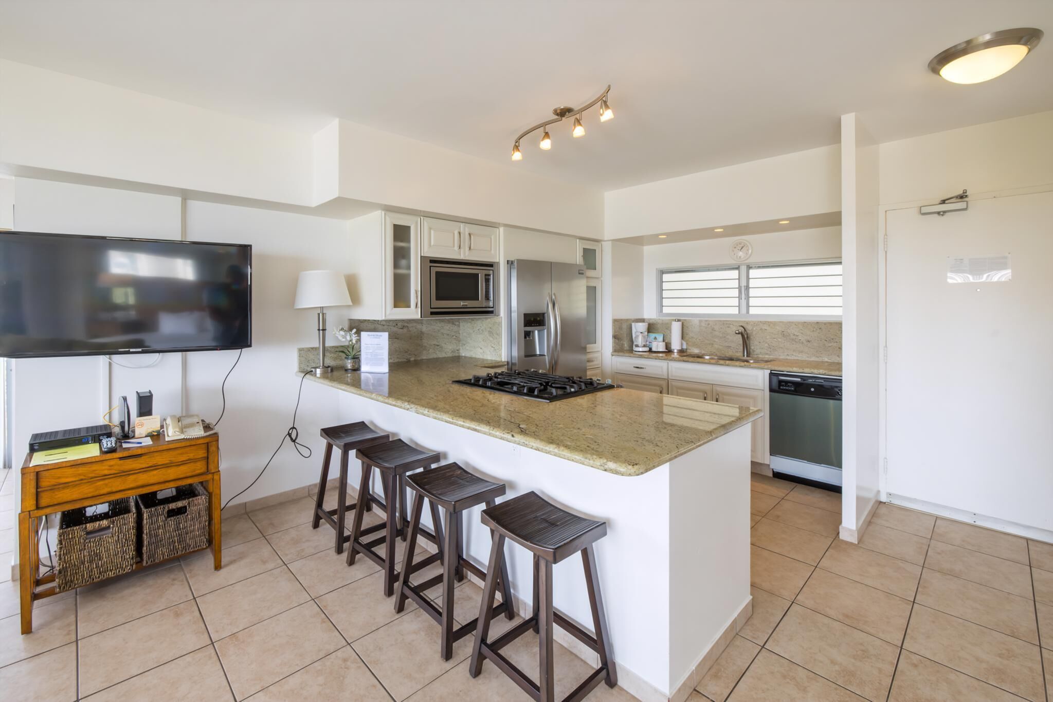 Fridge, stovetop, dishwasher, coffee/tea maker