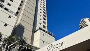 A tall, modern building with a prominent "Oscar" sign at the base. - Oscar on Main - Heart of Main Beach (Main Beach)