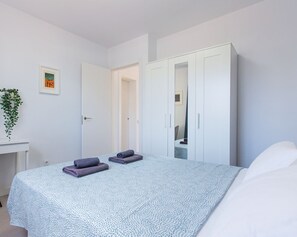 1 bedroom, desk, iron/ironing board, travel crib