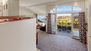 A spacious balcony with a view of the landscape. - ACACIA WATERS (Taupo)