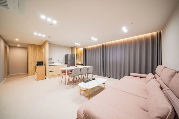 Premium Suite, City View | Living area | 75-inch Smart TV with cable channels, Netflix, streaming services