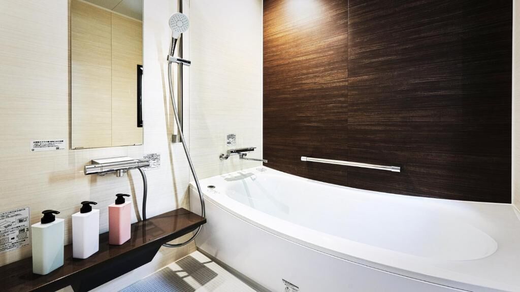 Separate tub and shower, free toiletries, hair dryer, slippers