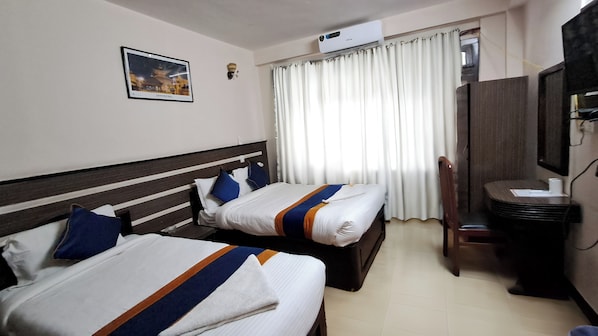 Premium bedding, memory-foam beds, laptop workspace, free WiFi