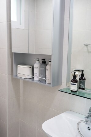 Shower, hair dryer, towels, soap