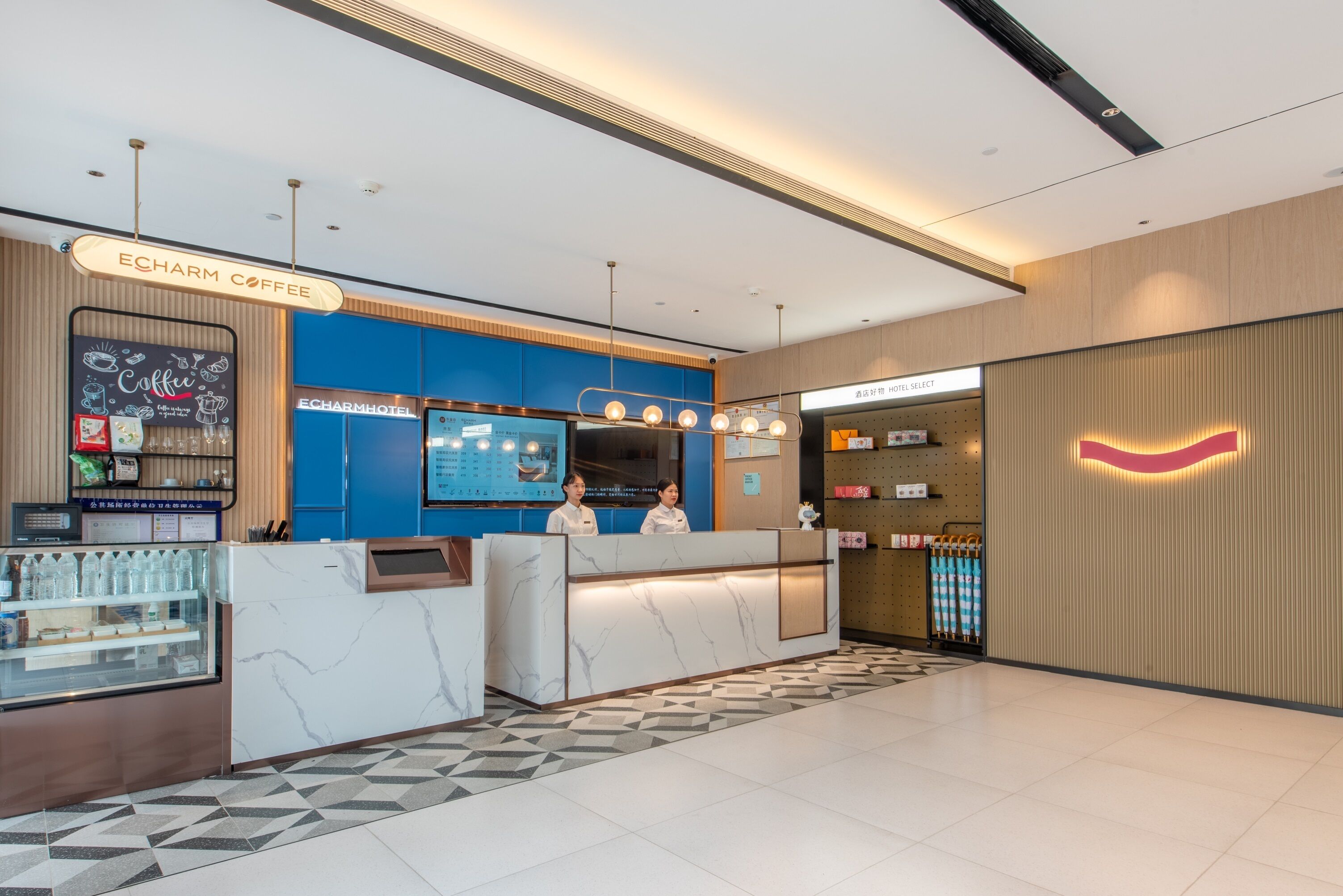 A hotel lobby with a reception desk, a coffee shop, and a hotel selection sign.