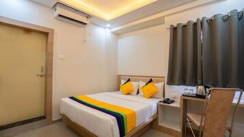 Economy Room | In-room safe, blackout curtains, iron/ironing board, rollaway beds