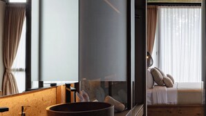 A modern bathroom with a large mirror, two sinks, and a wooden vanity. - The Akasha Canggu Luxury Villas (Canggu)