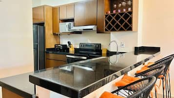 Fridge, microwave, stovetop, coffee/tea maker