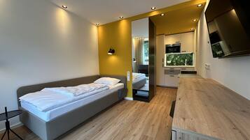 Quarto solteiro luxo, acessível, suíte | Individualmente decorados, individualmente mobiliados, Wi-Fi de cortesia