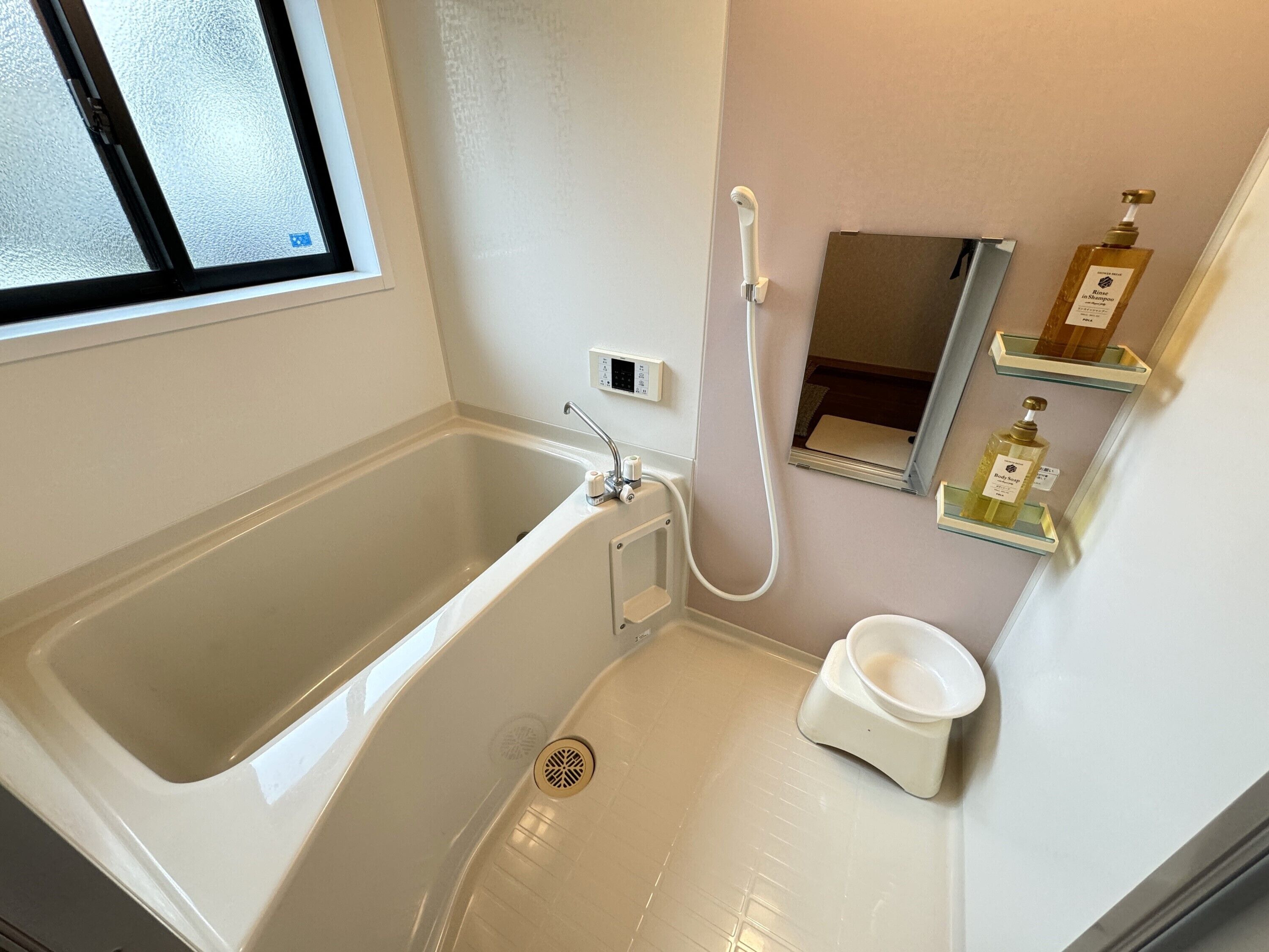 Basic Apartment, Non Smoking | Bathroom | Combined shower/tub, free toiletries, hair dryer, slippers