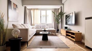 Family Apartment, 3 Bedrooms, Non Smoking | Living area | 50-inch Smart TV with satellite channels, Netflix, streaming services