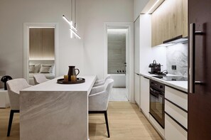 Apartamento executivo | Cozinha privada | Geladeira, fogão, cooktop, lava-louças