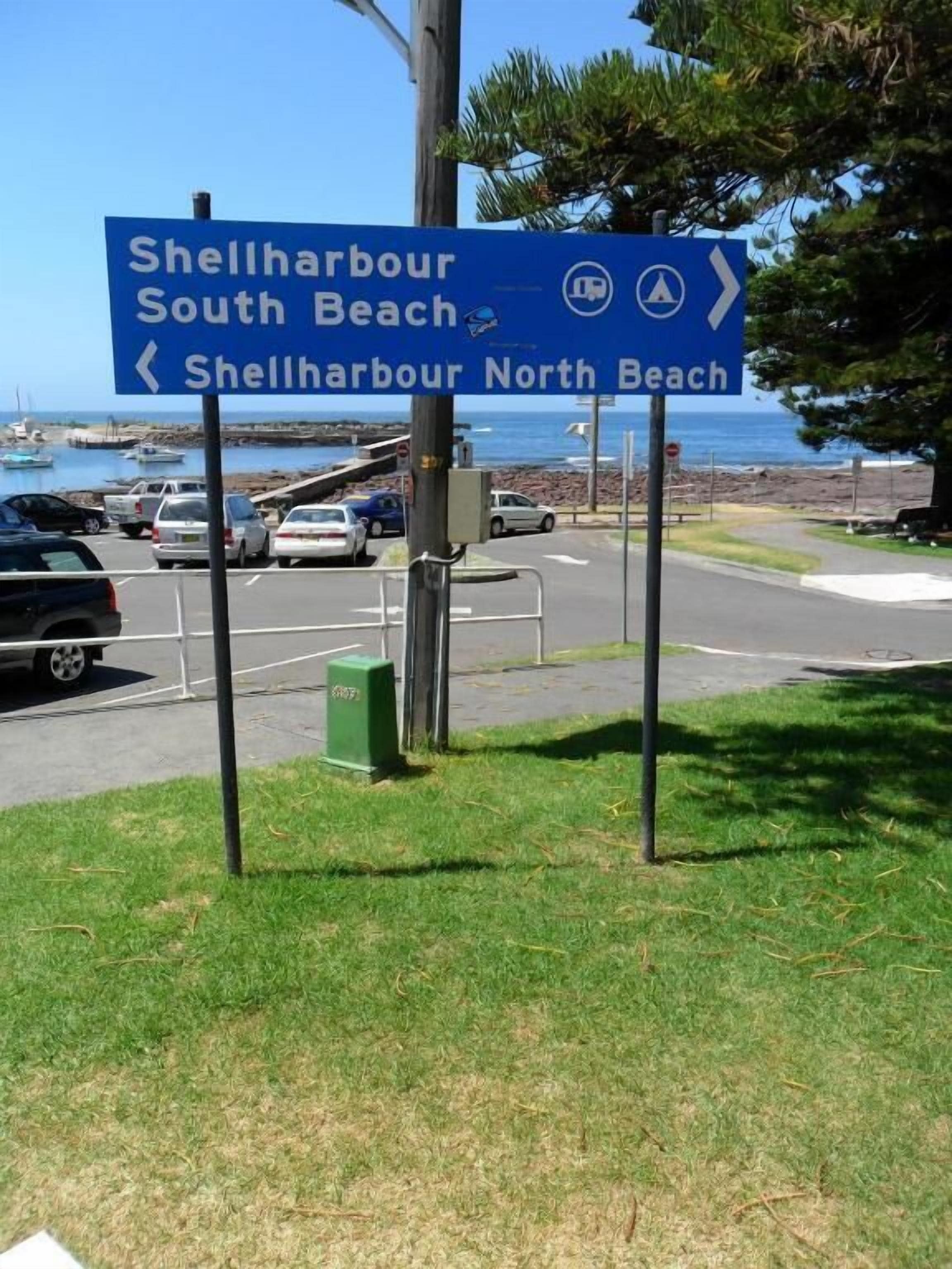 A directional sign for Shellharbour South Beach and Shellharbour North Beach.
