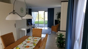 Enjoy meals in the dining area with a table and chairs, and relax in the seating area with a TV.