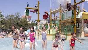 Children playing in a water park with various water features and play structures. - Spacious Stay Near the Sea (Breskens)