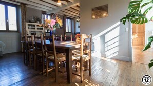 Comedor con mobiliario de madera y ventilador de techo.