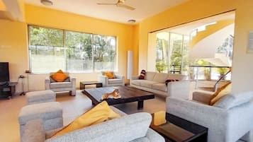 Deluxe Villa, Patio, Hill View | Living area | Flat-screen TV