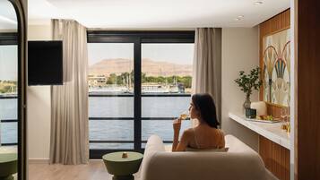 Royal Suite, River View | Minibar, in-room safe, iron/ironing board, free WiFi