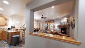 A modern kitchen with granite countertops, wooden cabinets, and a built-in trash can. - Pet Friendly Black Bear Townhome across from Purg - Views - Free Shuttle (Durango)
