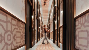 A hallway with a checkered floor, wooden walls, and patterned wallpaper. - The Diamond (Amsterdam)