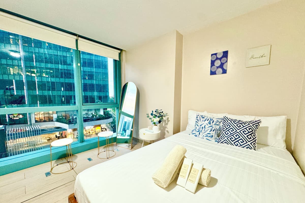 Condo familiar, varias camas, para no fumadores, vista a la ciudad | 1 habitación, tabla de planchar con plancha, wifi gratis y ropa de cama