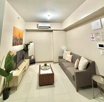 Premier Condo | Living area | 36-inch Smart TV with digital channels