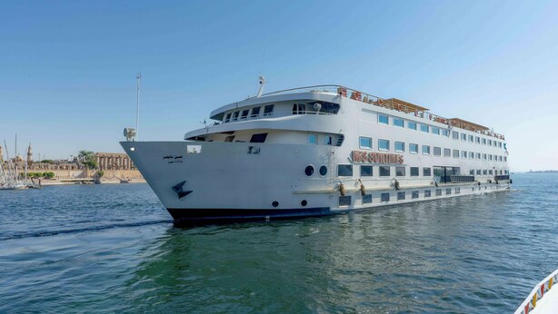 A large, multi-deck cruise ship named M/S SUNTIMES docked at a port. - Orient Sun Times Nile Cruise-Every Monday from Luxor for 04 & 07 Nights - Every Friday From Aswan for 03 Nights (Luxor)