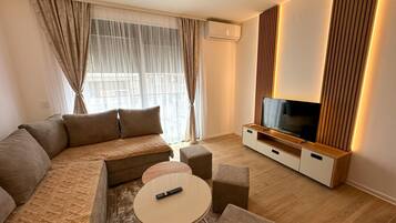 Căn hộ Deluxe | Khu phòng khách | TV màn hình phẳng