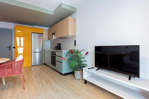 Basic Apartment, 1 Bedroom | Living area | 42-inch flat-screen TV with cable channels