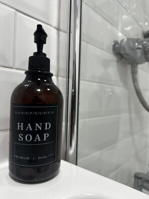 Hair dryer, towels, soap, shampoo