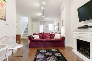 Smart TV, fireplace, books