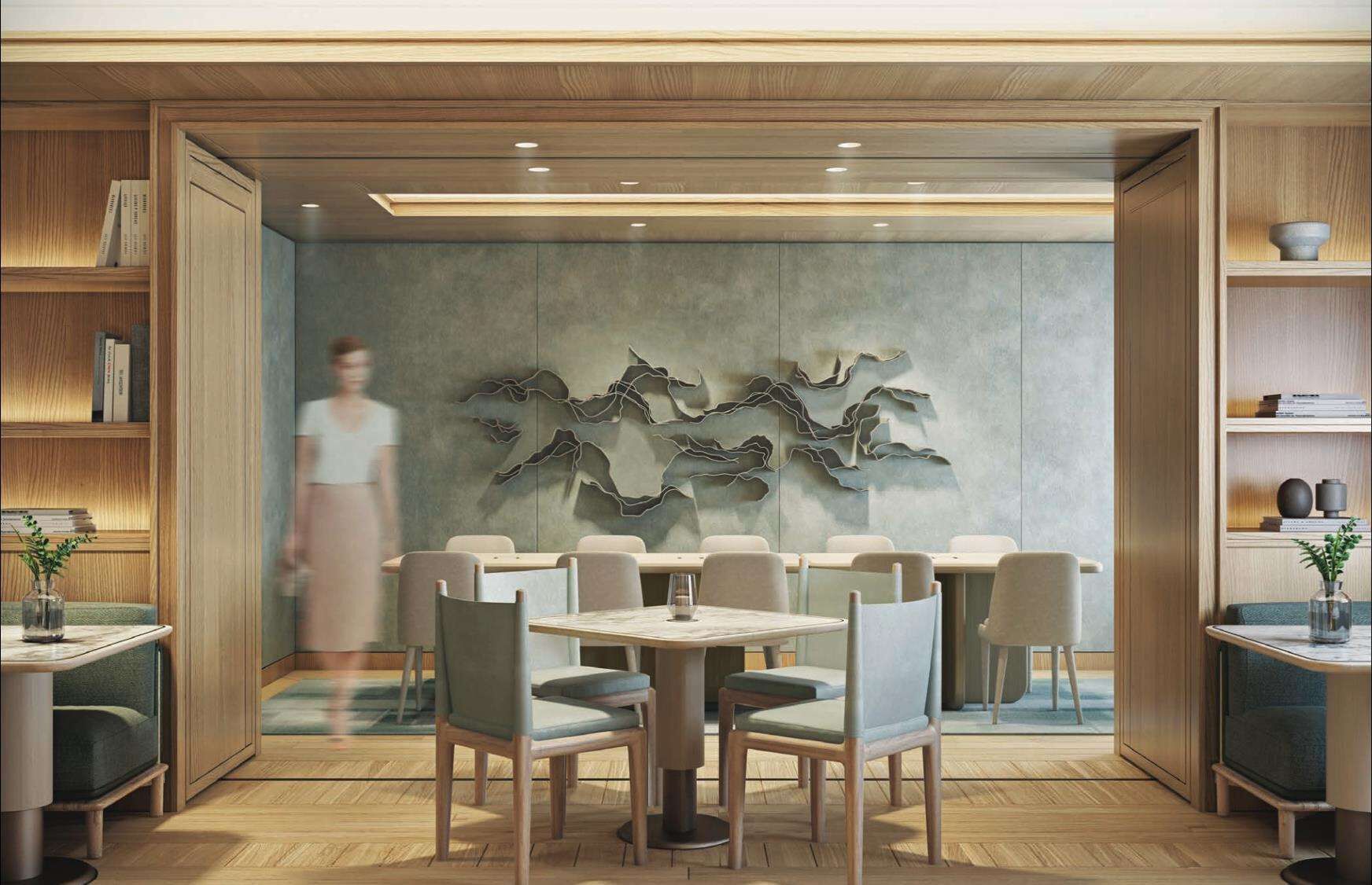 A modern dining area with wooden paneling, a central table with chairs, and a decorative wall piece.
